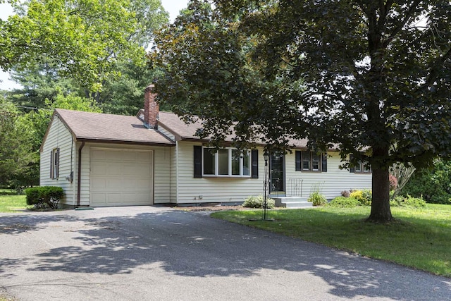 20 Sharon Dr, South Windsor, CT 06074 - view of front facade featuring a garage, a chimney, driveway, and a front lawn