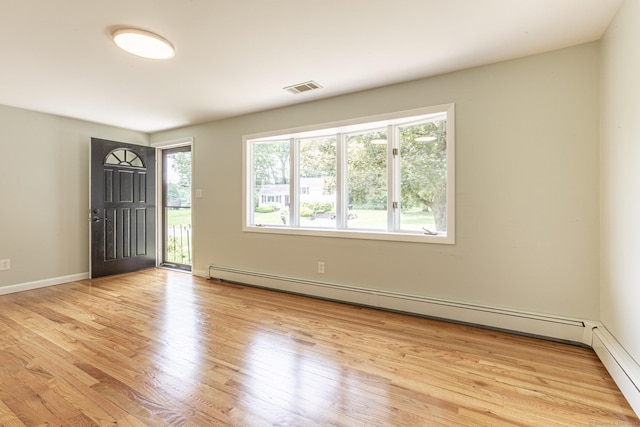 20 Sharon Dr, South Windsor, CT 06074 - foyer entrance with light wood-type flooring and baseboard heating