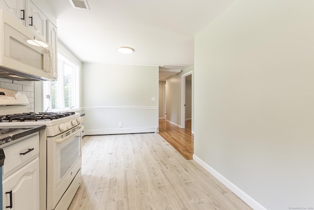 20 Sharon Dr, South Windsor, CT 06074 - kitchen with white appliances, a baseboard radiator, light wood-type flooring, white cabinetry, and dark countertops