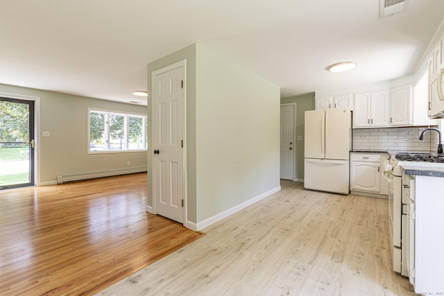 20 Sharon Dr, South Windsor, CT 06074 - kitchen with white appliances, a baseboard heating unit, white cabinets, and light wood finished floors