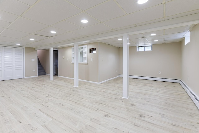20 Sharon Dr, South Windsor, CT 06074 - below grade area featuring baseboard heating, stairway, wood finished floors, and recessed lighting