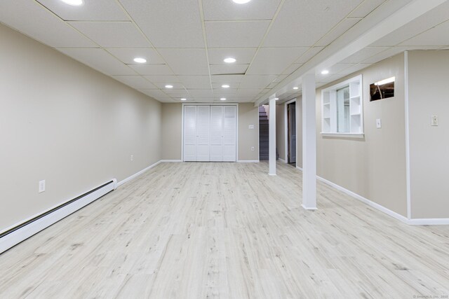 20 Sharon Dr, South Windsor, CT 06074 - finished basement with baseboard heating, wood finished floors, and recessed lighting