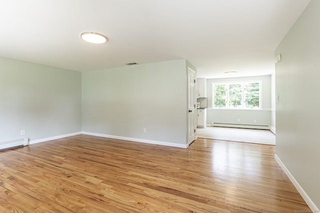 20 Sharon Dr, South Windsor, CT 06074 - unfurnished room with a baseboard radiator, light wood finished floors, and baseboard heating