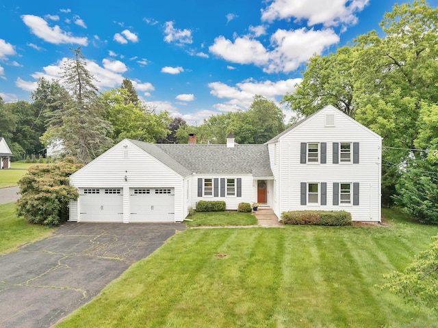 253 Gardner St, Manchester, CT 06040 - traditional-style home featuring asphalt driveway, a garage, roof with shingles, a chimney, and a front lawn