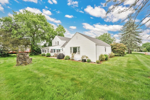 253 Gardner St, Manchester, CT 06040 - rear view of house with a lawn and roof with shingles