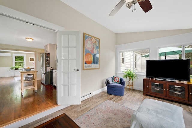 253 Gardner St, Manchester, CT 06040 - living area with lofted ceiling, a baseboard radiator, wood finished floors, and ceiling fan