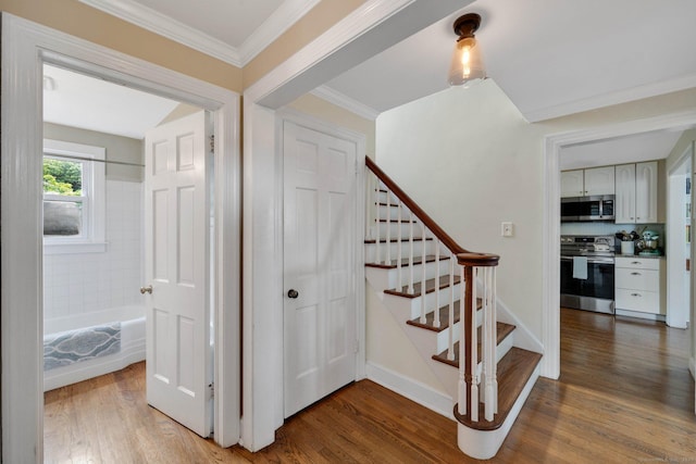 253 Gardner St, Manchester, CT 06040 - stairway featuring wood finished floors and crown molding