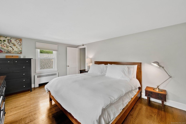 253 Gardner St, Manchester, CT 06040 - bedroom featuring radiator heating unit and wood finished floors