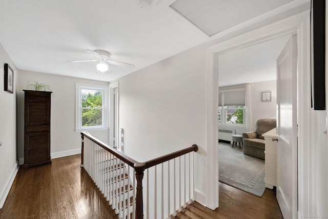 253 Gardner St, Manchester, CT 06040 - hall featuring radiator heating unit, an upstairs landing, and wood finished floors
