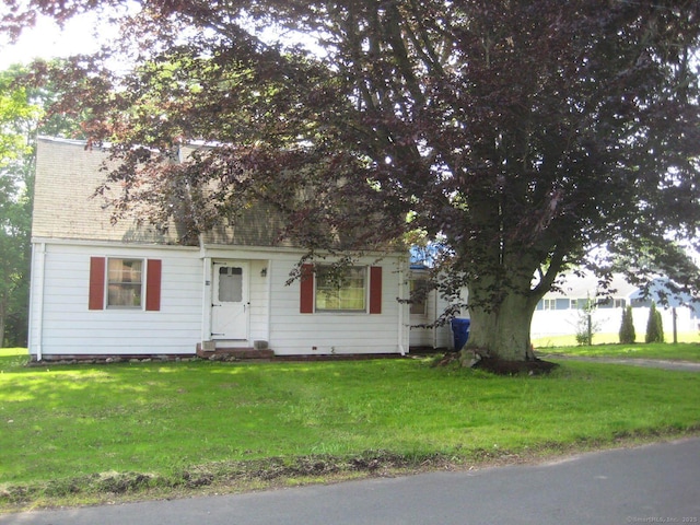 18 Lindsley St, Branford, CT 06405 - view of property hidden behind natural elements with a front yard and a shingled roof