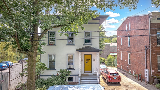 272 Saint John St, New Haven, CT 06511 - view of front facade featuring stucco siding and a shingled roof