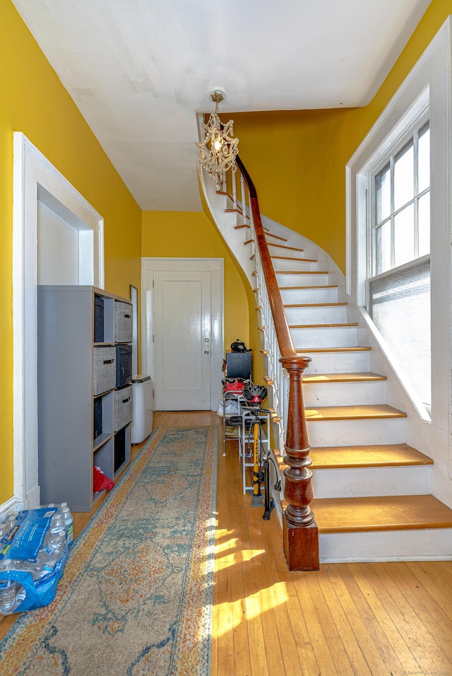 272 Saint John St, New Haven, CT 06511 - staircase featuring a chandelier and hardwood / wood-style floors