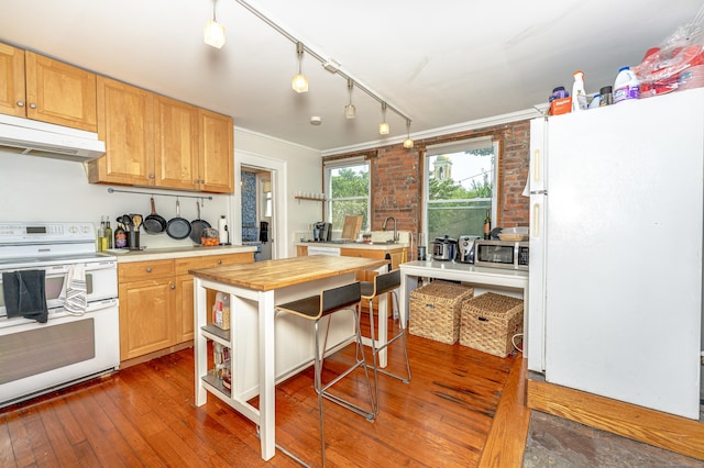 272 Saint John St, New Haven, CT 06511 - kitchen with white appliances, under cabinet range hood, crown molding, butcher block counters, and open shelves