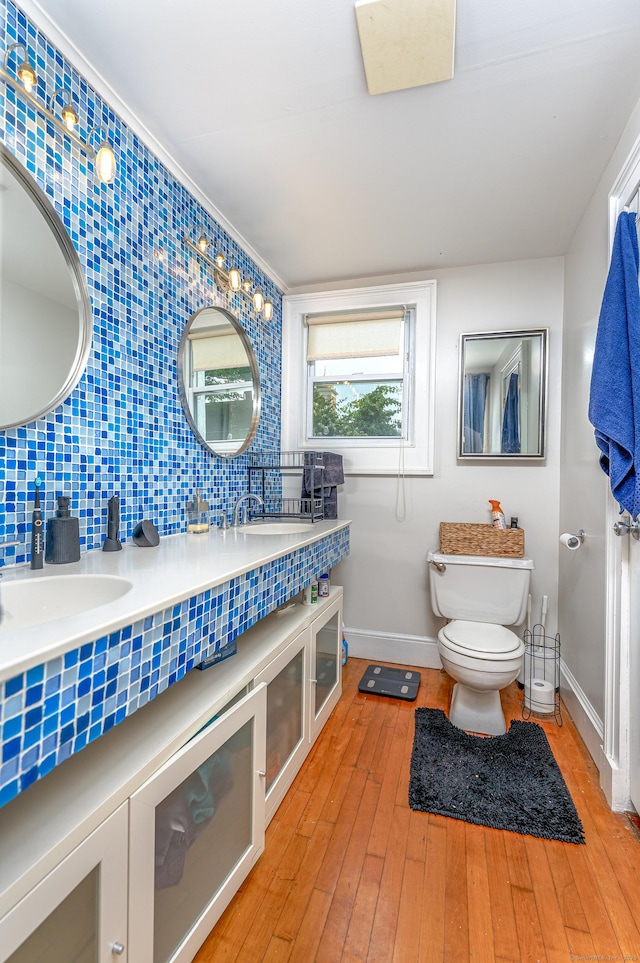 272 Saint John St, New Haven, CT 06511 - full bathroom with double vanity, decorative backsplash, and hardwood / wood-style floors