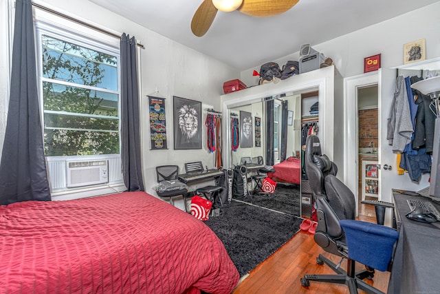 272 Saint John St, New Haven, CT 06511 - bedroom with multiple windows, wood finished floors, an office area, and a closet