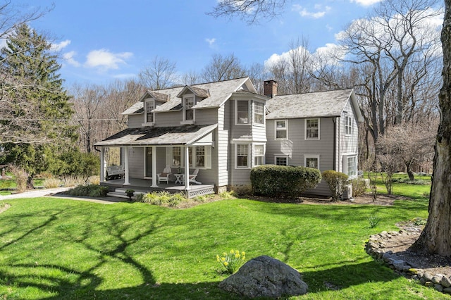 634 Nod Hill Rd, Wilton, CT 06897 - rear view of property featuring a porch, a chimney, and a yard