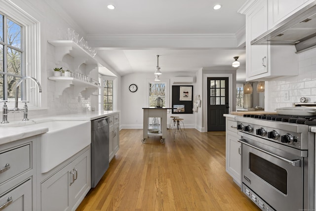 634 Nod Hill Rd, Wilton, CT 06897 - kitchen with appliances with stainless steel finishes, under cabinet range hood, tasteful backsplash, open shelves, and plenty of natural light