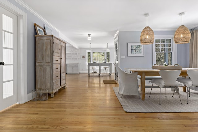 634 Nod Hill Rd, Wilton, CT 06897 - dining area featuring light wood-style flooring and crown molding