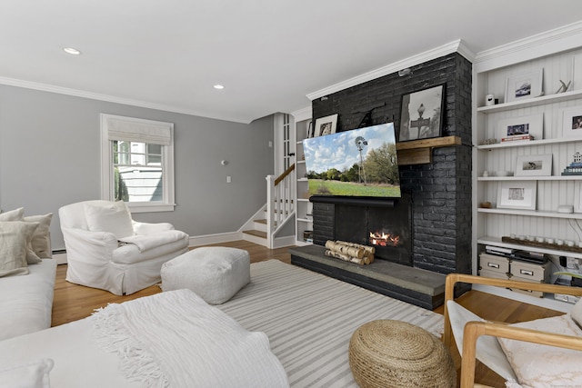 634 Nod Hill Rd, Wilton, CT 06897 - living area with ornamental molding, wood finished floors, a fireplace, stairs, and recessed lighting