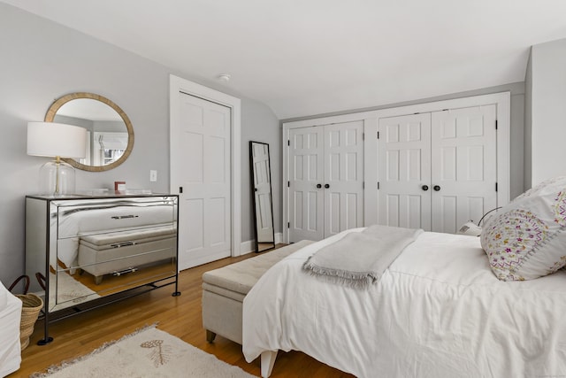 634 Nod Hill Rd, Wilton, CT 06897 - bedroom featuring two closets and wood finished floors