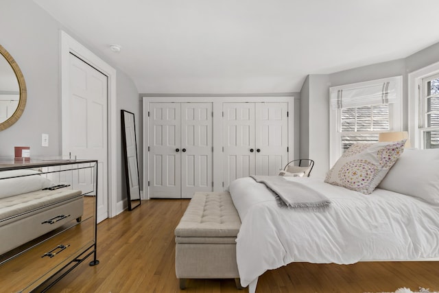 634 Nod Hill Rd, Wilton, CT 06897 - bedroom featuring multiple closets and light wood-type flooring