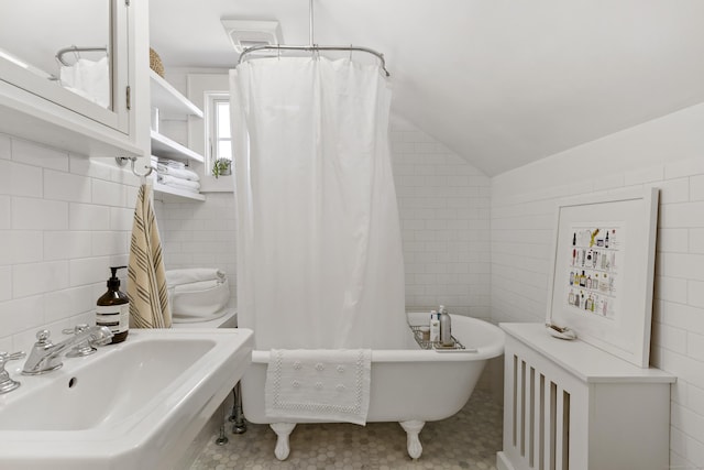 634 Nod Hill Rd, Wilton, CT 06897 - bathroom with tile walls and vaulted ceiling