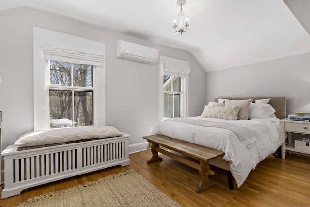 634 Nod Hill Rd, Wilton, CT 06897 - bedroom with an AC wall unit, lofted ceiling, wood finished floors, and a chandelier
