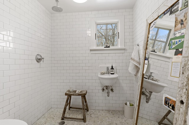 634 Nod Hill Rd, Wilton, CT 06897 - bathroom with a tile shower, tile patterned floors, and tile walls