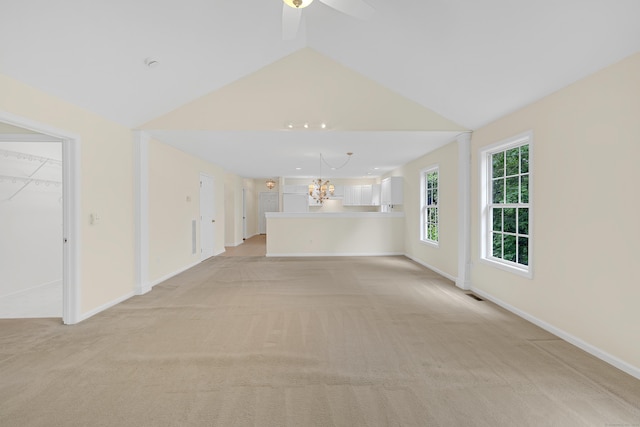 153 Louis Hill Rd Unit 153, Newtown, CT 06482 - unfurnished living room featuring light colored carpet, lofted ceiling, ceiling fan, and a chandelier