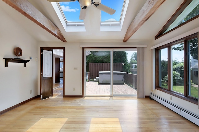 134 Millard St, Fairfield, CT 06824 - empty room featuring a skylight, baseboard heating, a ceiling fan, and light wood-style floors