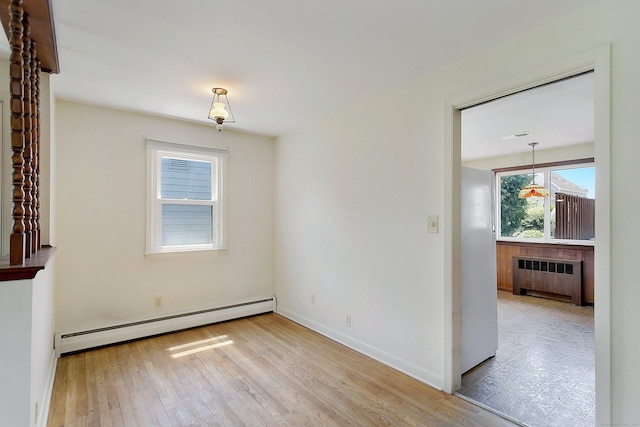 134 Millard St, Fairfield, CT 06824 - spare room featuring radiator, baseboard heating, and wood finished floors