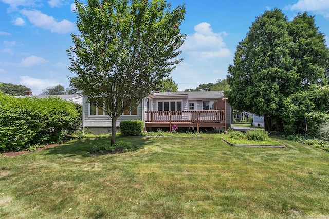 134 Millard St, Fairfield, CT 06824 - rear view of house with a deck and a yard
