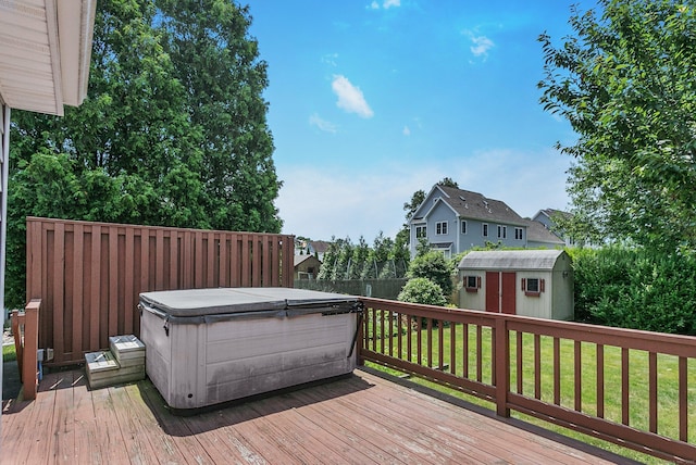 134 Millard St, Fairfield, CT 06824 - wooden terrace featuring a hot tub, a storage unit, and a fenced backyard