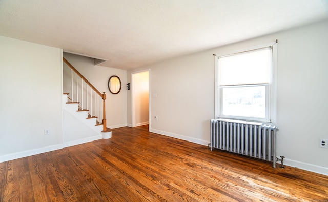 103 Saltonstall Pkwy, East Haven, CT 06512 - spare room featuring radiator, wood finished floors, and stairs