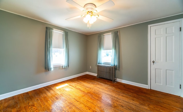 103 Saltonstall Pkwy, East Haven, CT 06512 - unfurnished room with radiator, a ceiling fan, wood finished floors, and crown molding
