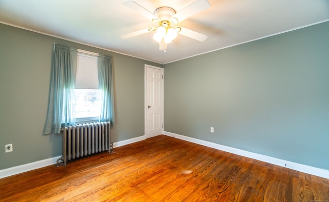 103 Saltonstall Pkwy, East Haven, CT 06512 - empty room with radiator heating unit, crown molding, a ceiling fan, and wood finished floors