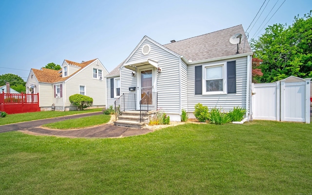 103 Saltonstall Pkwy, East Haven, CT 06512 - view of front of home with roof with shingles and a gate