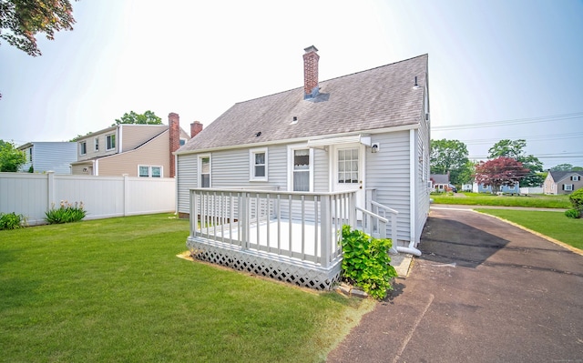 103 Saltonstall Pkwy, East Haven, CT 06512 - back of property with a deck, a chimney, and a shingled roof