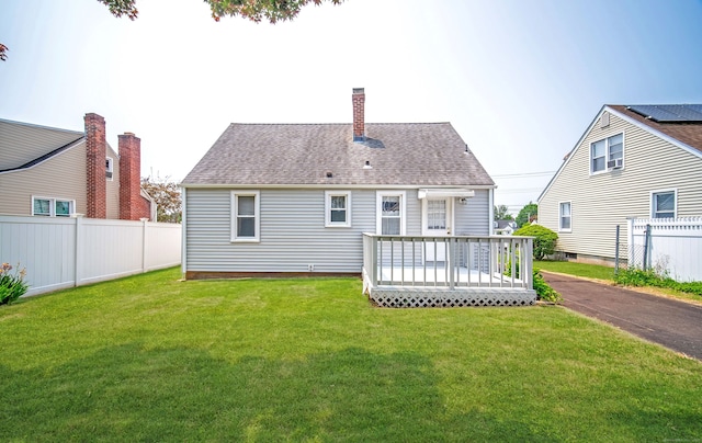 103 Saltonstall Pkwy, East Haven, CT 06512 - back of house featuring a deck, a shingled roof, and a chimney