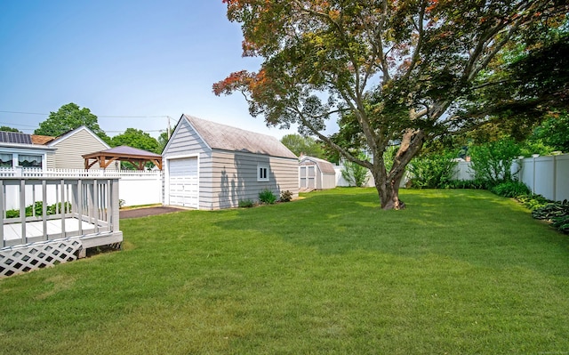 103 Saltonstall Pkwy, East Haven, CT 06512 - fenced backyard with a gazebo, a detached garage, a deck, and a storage shed
