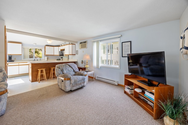 81 Standish Rd, Coventry, CT 06238 - living room with a baseboard heating unit, a wall mounted AC, and light carpet