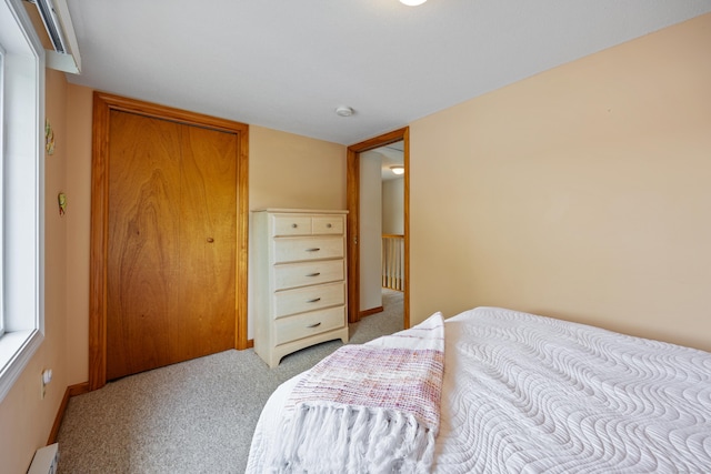 81 Standish Rd, Coventry, CT 06238 - bedroom with baseboard heating, light carpet, and a closet