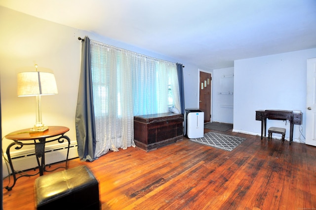 9 Eleanor Rd, Enfield, CT 06082 - living area featuring baseboard heating and wood finished floors