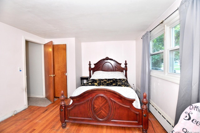 9 Eleanor Rd, Enfield, CT 06082 - bedroom with baseboard heating and light wood finished floors