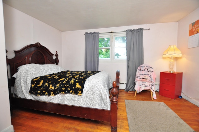 9 Eleanor Rd, Enfield, CT 06082 - bedroom with wood finished floors and a baseboard radiator