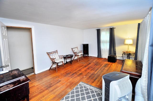9 Eleanor Rd, Enfield, CT 06082 - sitting room with baseboard heating and hardwood / wood-style floors
