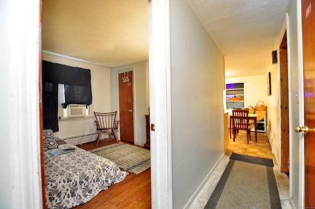9 Eleanor Rd, Enfield, CT 06082 - hall with cooling unit, a baseboard heating unit, and wood finished floors