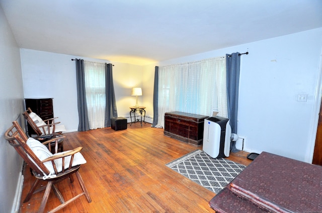 9 Eleanor Rd, Enfield, CT 06082 - sitting room featuring a baseboard heating unit and wood finished floors