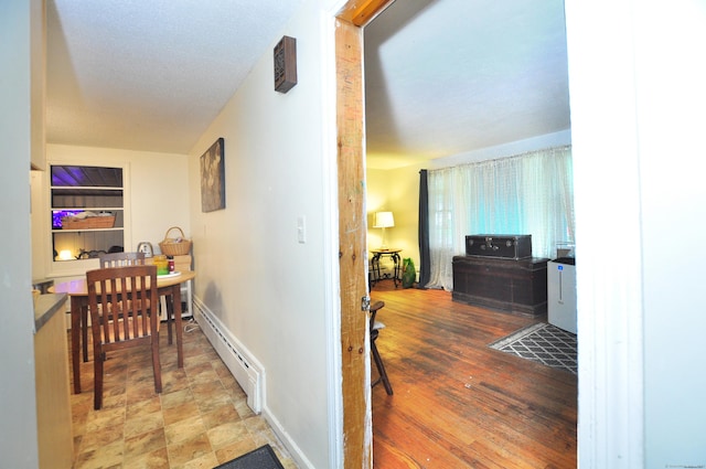 9 Eleanor Rd, Enfield, CT 06082 - corridor with a baseboard heating unit and baseboards