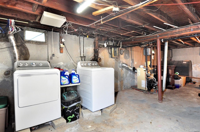 9 Eleanor Rd, Enfield, CT 06082 - unfinished basement featuring washer and clothes dryer, a heating unit, and heating fuel